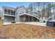 House backyard with deck, stairs and fire pit at 123 Line Creek Way, Sharpsburg, GA 30277