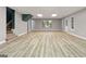 Finished basement offering a large open space and wood-look flooring at 123 Line Creek Way, Sharpsburg, GA 30277