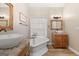 Bathroom with freestanding tub, vessel sink, and wood vanity at 123 Line Creek Way, Sharpsburg, GA 30277