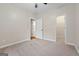 Well-lit bedroom with carpet, access to a hallway and closet at 123 Line Creek Way, Sharpsburg, GA 30277