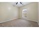 Simple bedroom with carpeted floor and large window at 123 Line Creek Way, Sharpsburg, GA 30277