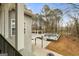 Deck overlooking backyard with pool and wooded area at 123 Line Creek Way, Sharpsburg, GA 30277