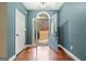 Bright entryway with hardwood floors and blue walls at 123 Line Creek Way, Sharpsburg, GA 30277