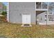 House exterior with double doors leading to a basement at 123 Line Creek Way, Sharpsburg, GA 30277