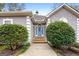 Front entrance with blue door and stone pathway at 123 Line Creek Way, Sharpsburg, GA 30277