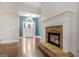 Living room with stone fireplace and hardwood floors at 123 Line Creek Way, Sharpsburg, GA 30277