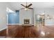 Spacious living room with hardwood floors and fireplace at 123 Line Creek Way, Sharpsburg, GA 30277