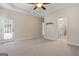 Main bedroom with private door to deck and en-suite bathroom at 123 Line Creek Way, Sharpsburg, GA 30277