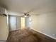 Spacious bedroom with carpet, ceiling fan and access to a bathroom at 2490 Habersham Dr, Decatur, GA 30032