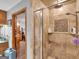 Bathroom featuring a shower and a view into bedroom at 930 Singley Dr, Locust Grove, GA 30248