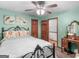 Bedroom with a queen bed, ceiling fan and vanity at 930 Singley Dr, Locust Grove, GA 30248