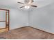 Light and airy bedroom with ceiling fan and access to another room at 930 Singley Dr, Locust Grove, GA 30248