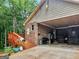 Brick garage with covered area,ample parking and storage at 930 Singley Dr, Locust Grove, GA 30248