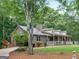 Ranch-style brick home with a spacious yard and porch at 930 Singley Dr, Locust Grove, GA 30248