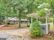 Quaint wishing well in front of the house and yard at 930 Singley Dr, Locust Grove, GA 30248