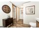 Simple bathroom with toilet and vanity; access to a walk-in closet at 58 Pinewood Dr, Carrollton, GA 30116