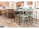 Kitchen island seating with four stylish green chairs at 58 Pinewood Dr, Carrollton, GA 30116