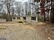 Front view of a tan mobile home with a wooden deck at 58 Pinewood Dr, Carrollton, GA 30116