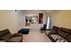 Bright living room with hardwood floors and view into kitchen at 635 Watson Bay, Stone Mountain, GA 30087