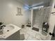 Updated bathroom with marble-tiled shower and modern vanity at 2572 Plantation, Atlanta, GA 30344