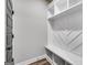 Mudroom with built-in bench, cubbies, and white shiplap at 8870 Callaway Drive, Winston, GA 30187