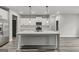 Modern kitchen with white cabinets, quartz countertops, and large island at 8950 Callaway Drive, Winston, GA 30187