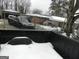 Large backyard with a partially visible home and snow-covered ground at 1434 Butler St, Jonesboro, GA 30236