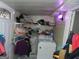 Small laundry room with washer and shelving at 1434 Butler St, Jonesboro, GA 30236
