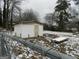 Small storage shed in snowy backyard at 1434 Butler St, Jonesboro, GA 30236