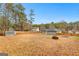 Spacious backyard with fire pit and privacy fence at 206 Sandown Drive, Peachtree City, GA 30269