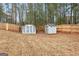 Fenced backyard with two storage sheds at 206 Sandown Dr, Peachtree City, GA 30269