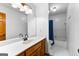 Clean bathroom with a shower/tub combo and wood vanity at 206 Sandown Drive, Peachtree City, GA 30269