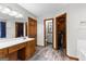 Double vanity bathroom with walk-in shower and closet at 206 Sandown Dr, Peachtree City, GA 30269