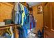 Spacious walk-in closet with clothing and shelving at 206 Sandown Drive, Peachtree City, GA 30269