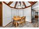 Dining area features a wood table and chairs, and vaulted ceiling with fan at 206 Sandown Drive, Peachtree City, GA 30269