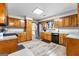 Kitchen with ample wood cabinets, stainless steel appliances, and vinyl flooring at 206 Sandown Drive, Peachtree City, GA 30269