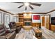 Living room with hardwood floors, fireplace and comfy seating at 206 Sandown Dr, Peachtree City, GA 30269