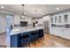 Modern kitchen with island, stainless steel appliances, and white cabinets at 4960 Shade Creek Xing, Cumming, GA 30028