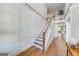 Open staircase with hardwood floors and white railings at 4960 Shade Creek Xing, Cumming, GA 30028