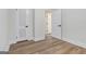 Spacious bedroom with wood-look flooring and ample closet space at 1091 Pine St, Conyers, GA 30012