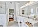 Elegant bathroom with double vanity and large mirror at 125 Fawn Brook Pass, Fayetteville, GA 30215