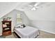 Cozy bedroom featuring a ceiling fan and built-in shelving at 125 Fawn Brook Pass, Fayetteville, GA 30215