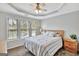 Cozy bedroom with carpeted floors and ceiling fan at 125 Fawn Brook Pass, Fayetteville, GA 30215