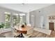 Bright dining room featuring a round wooden table and light flooring at 125 Fawn Brook Pass, Fayetteville, GA 30215