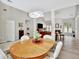 Open concept dining room with hardwood floors and a view of the living room at 125 Fawn Brook Pass, Fayetteville, GA 30215