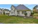 Two-story house with backyard patio and landscaped lawn at 125 Fawn Brook Pass, Fayetteville, GA 30215