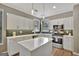 Modern kitchen with white cabinets, stainless steel appliances, and an island at 125 Fawn Brook Pass, Fayetteville, GA 30215