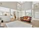 Open concept living room with high ceilings, hardwood floors and a view of the kitchen at 125 Fawn Brook Pass, Fayetteville, GA 30215