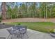 Patio furniture and string lights create a relaxing space at 125 Fawn Brook Pass, Fayetteville, GA 30215