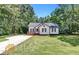 Charming one-story house with a spacious lawn and driveway at 6350 Park St, Union City, GA 30291